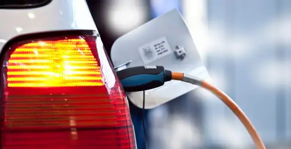 Electric car plugged into EV charger after professional installation in Sarasota, FL