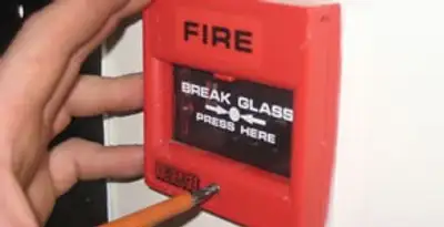 fire alarm installation service showing manual fire alarm pull station installed by licensed electricians in Sarasota, FL