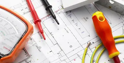 licensed electrician planning and testing electrical systems using professional tools in Sarasota, FL
