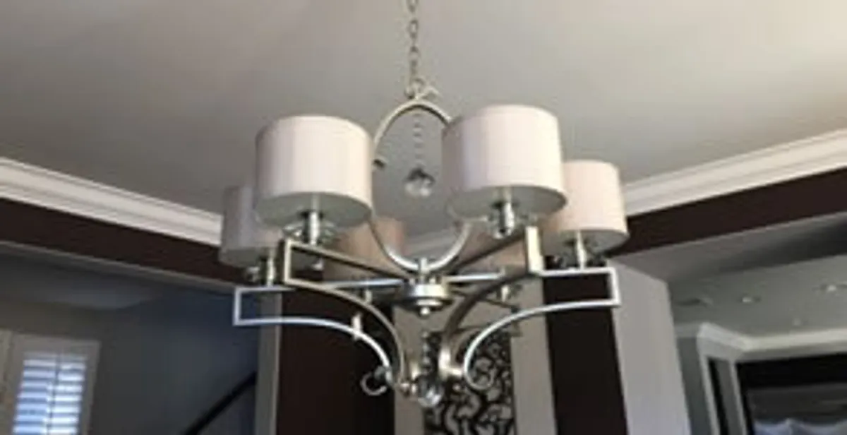 Modern chandelier installation with multiple light fixtures in Sarasota, FL