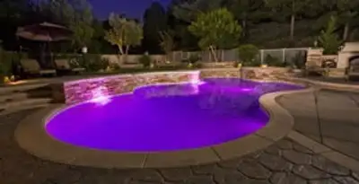 pool light installation and repair services illuminating a residential swimming pool in Sarasota, FL