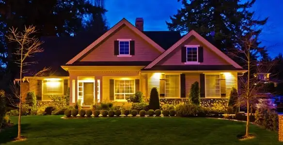 security light installation services illuminating a residential exterior at night in Sarasota, FL