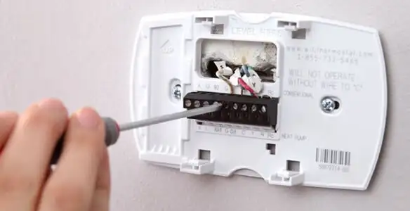 Thermostat installation service with proper wiring and secure wall mounting in Sarasota, FL
